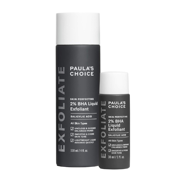 Bottle of Paula’s Choice 2% BHA Liquid Exfoliant placed on a marble bathroom counter with clean, minimal design.