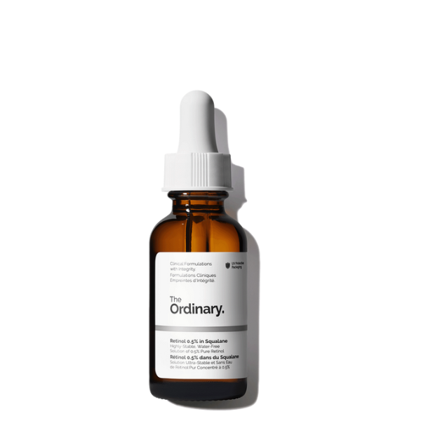 Dropper bottle of The Ordinary Retinol 0.5% in Squalane on a white background with a soft focus on its amber glass and minimalist label.